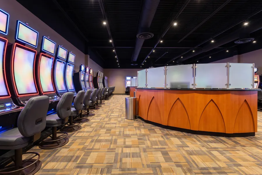 Slot machines beside the orange arched counter